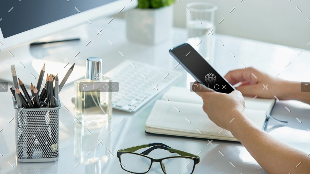 demo-attachment-399-close-up-of-female-hands-using-smart-phone-while-PWQR3QP